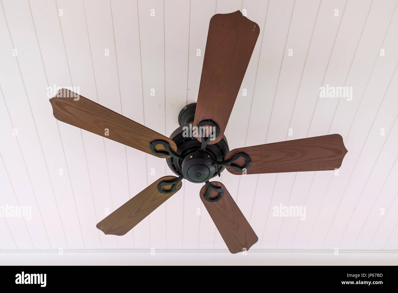 Vintage wooden fan hang on ceiling Stock Photo