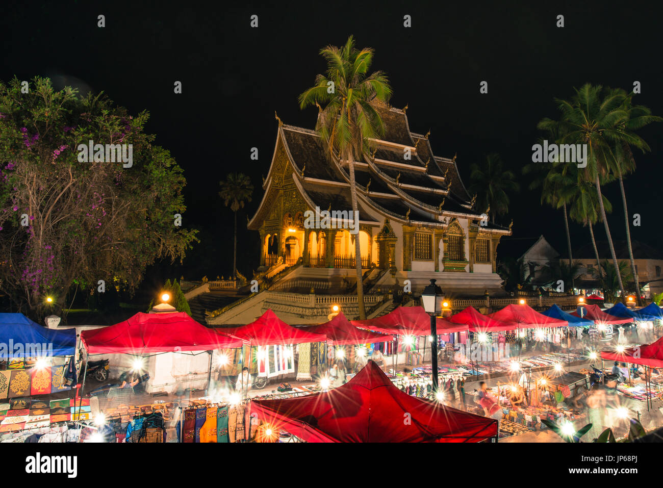 LUANG PRABANG, LAOS - MARCH 11, 2017: From the top, long exposition picture of Haw Pha Bang and Night Market, located on the grounds of the Royal Pala Stock Photo