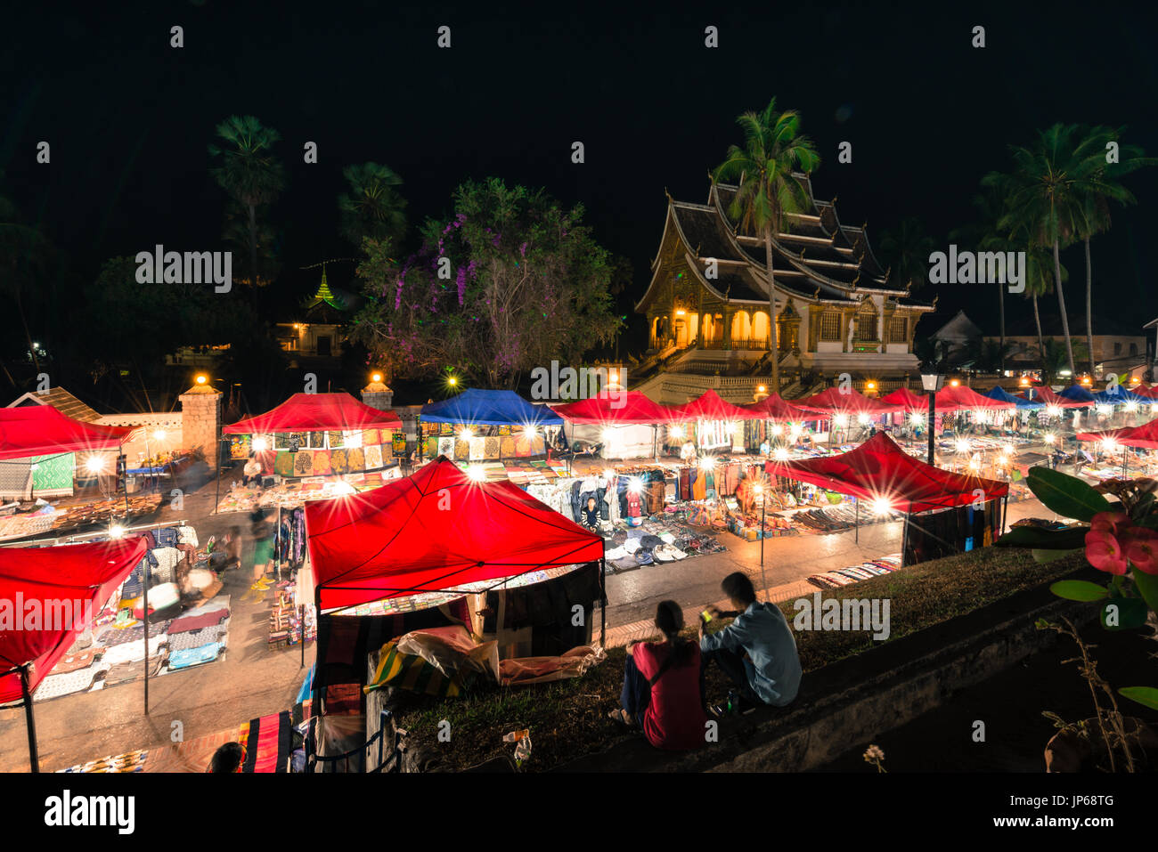 LUANG PRABANG, LAOS - MARCH 11, 2017: From the top, wide angle picture of Haw Pha Bang and Night Market, located on the grounds of the Royal Palace Mu Stock Photo