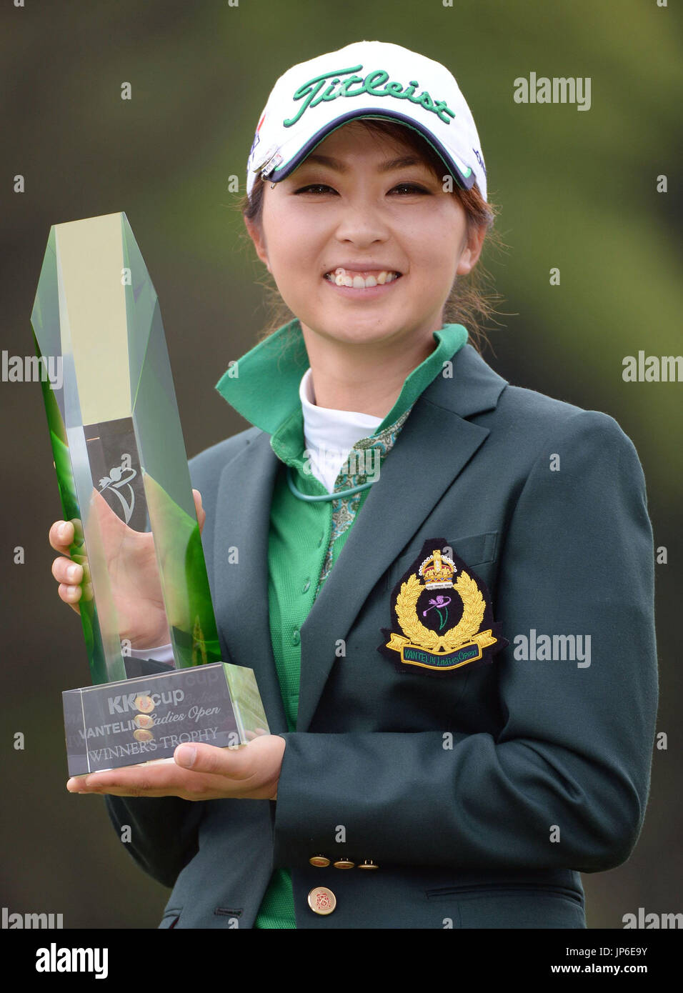 Erika Kikuchi of Japan shows off the winner's trophy after claiming the KKT  Vantelin Ladies Open, her first JLPGA title, with a 9-under 207 total at  the Kumamoto Airport Country Club in