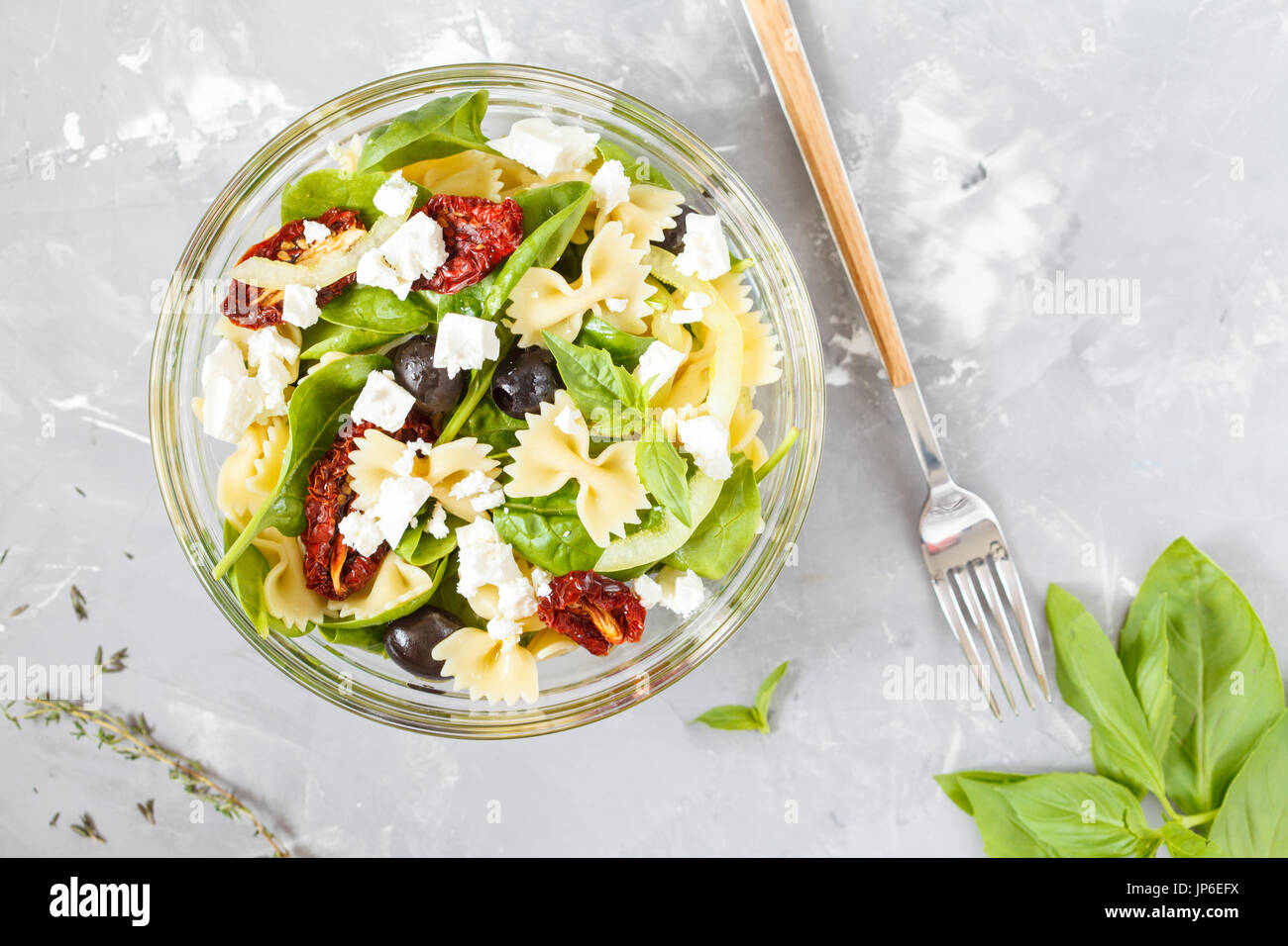 Homemade pasta salad with sun dried tomatoes, olives and feta Stock