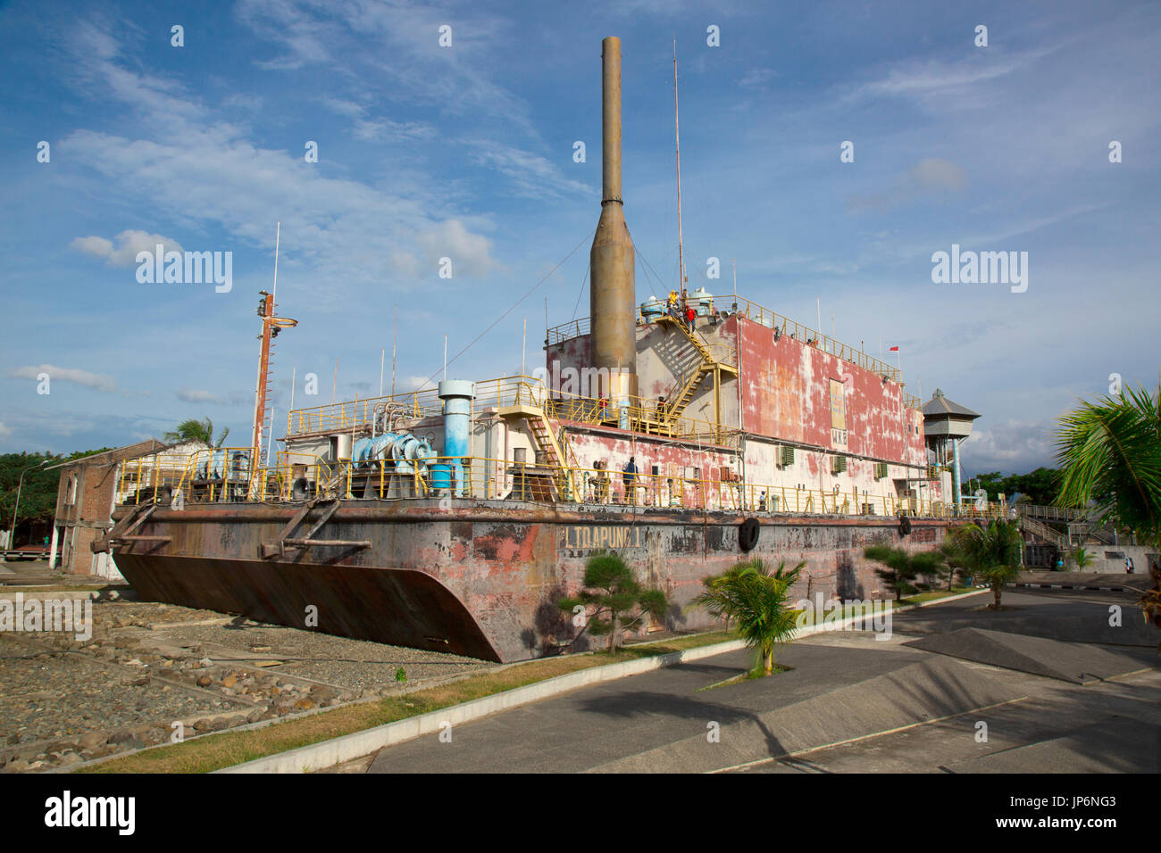 People explore the Apung electrical generator ship, moved several kilometres inland by the 2004 tsunami in Banda Aceh, Indonesia Stock Photo