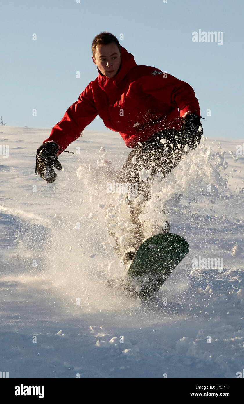 Young man snowboarding in Nidderdale. North Yorkshire Stock Photo Alamy