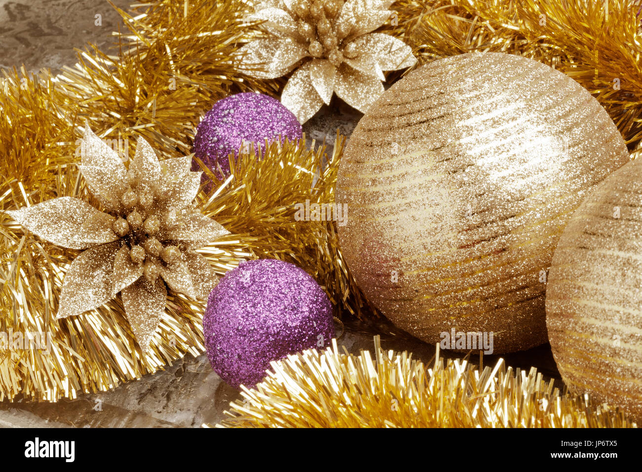 Shallow focus on a close up view of golden Christmas set decoration. Stock Photo