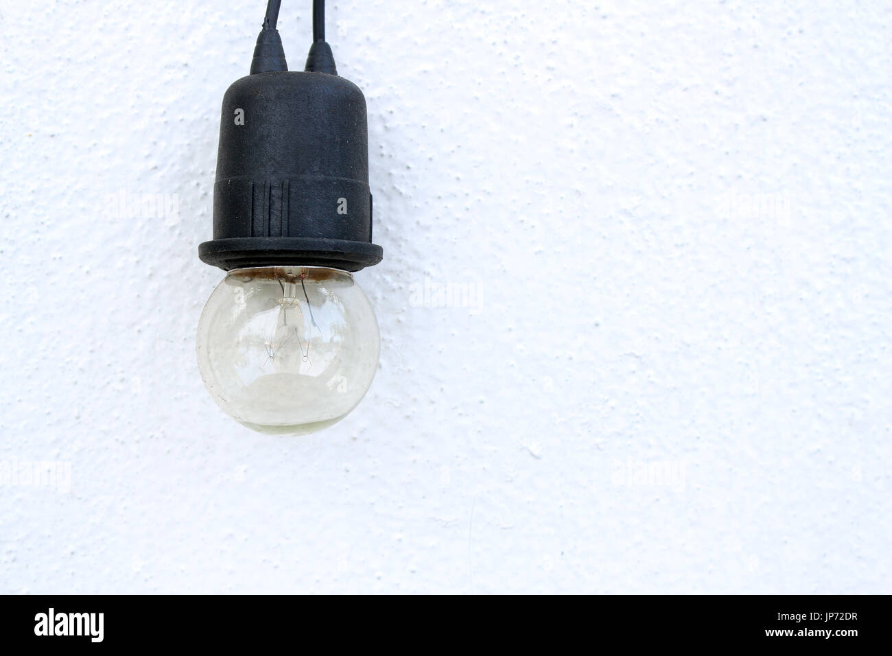 bulb on white wall background Stock Photo