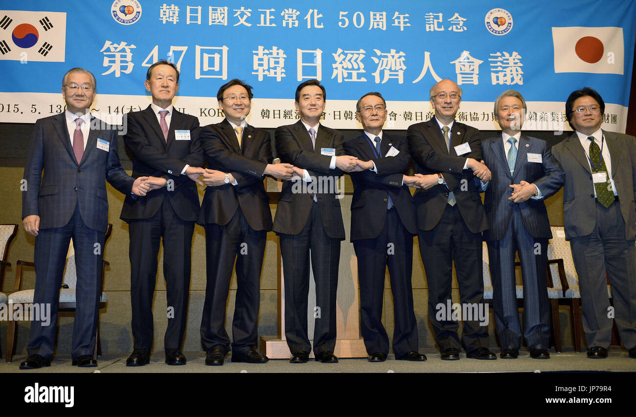 Business leaders from Japan and South Korea pose for a group photo in ...