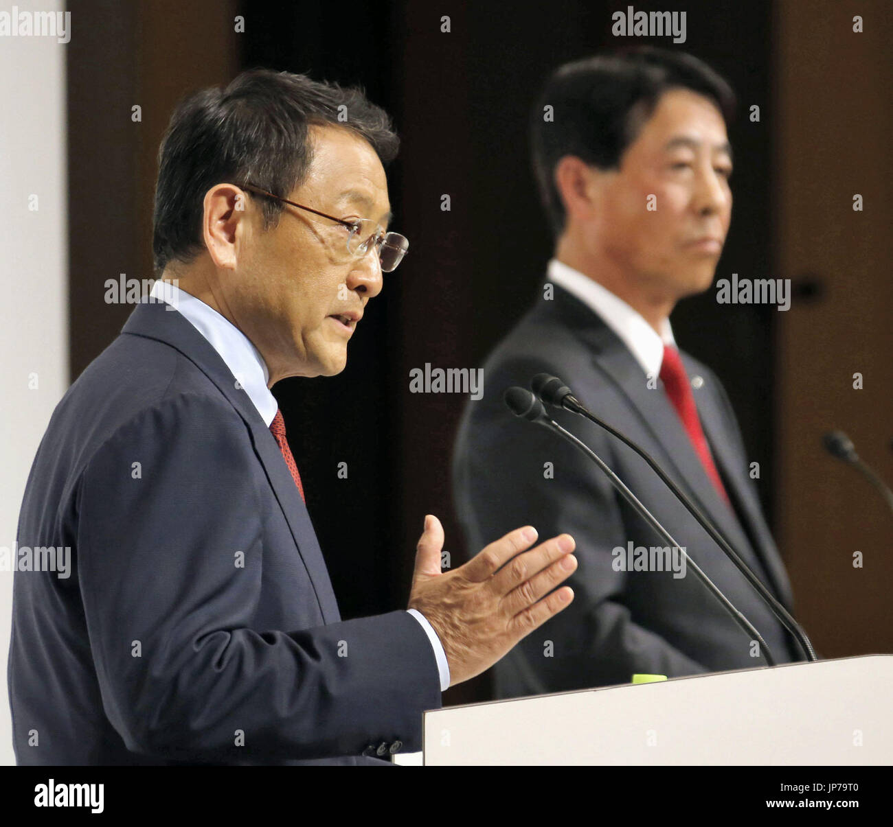 Akio Toyoda (L), president of Toyota Motor Corp., and Masamichi Kogai ...