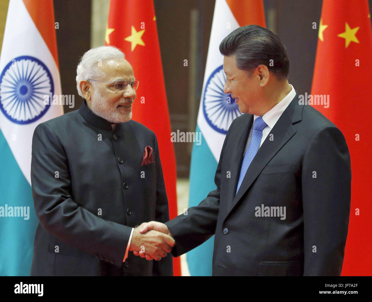 Chinese President Xi Jinping (R) and Indian Prime Minister Narendra ...