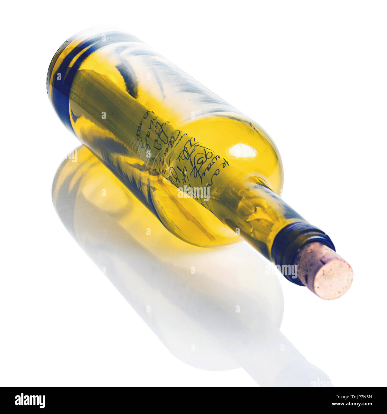 Wine bottle with a cast-away note inside asking for help. The bottle and also the reflection have separate clipping paths for easy removal. Stock Photo