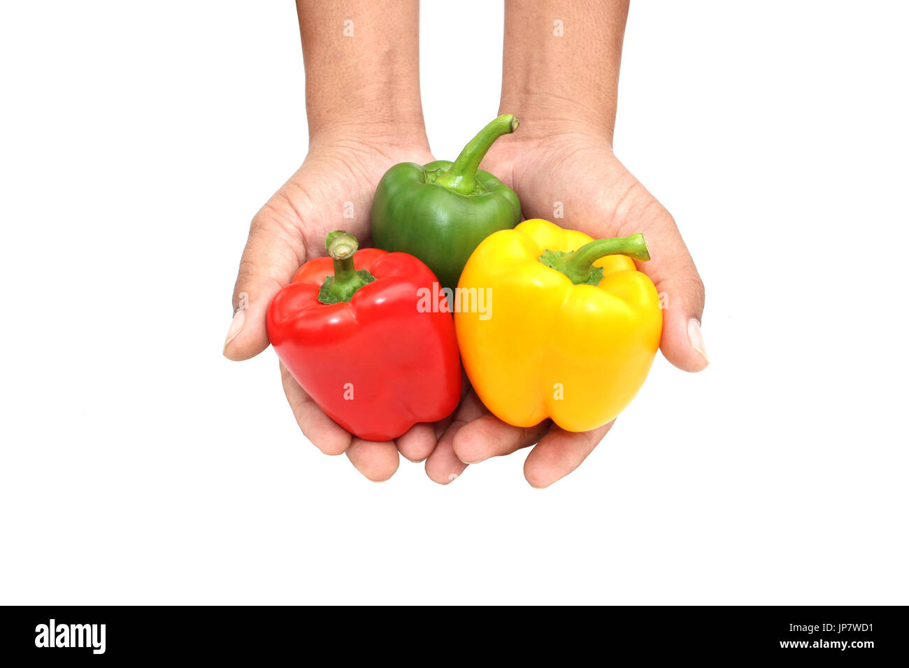 hands holding sweet peppers on white background Stock Photo Alamy
