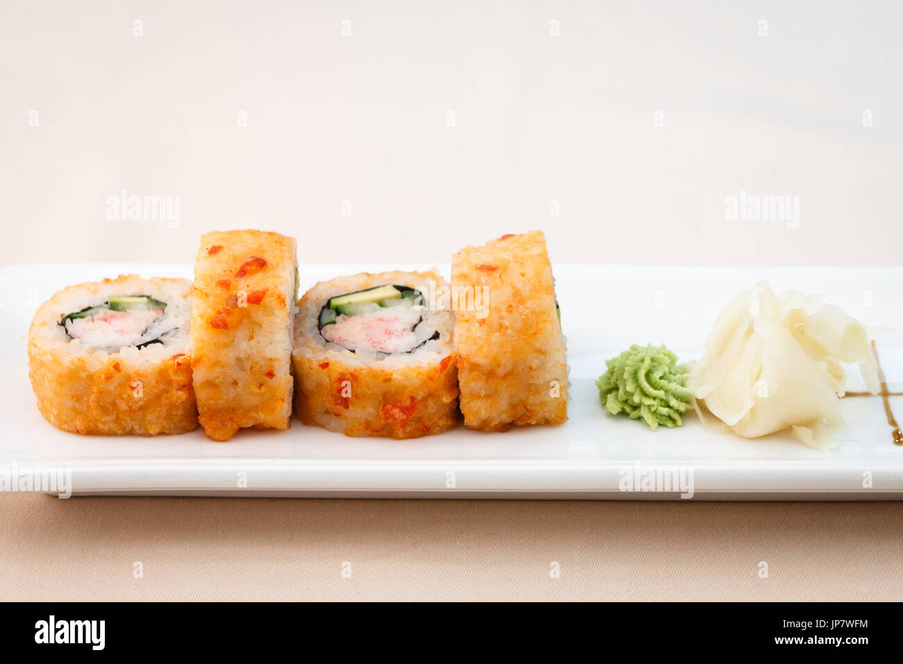 Flying fish roe maki Stock Photo - Alamy
