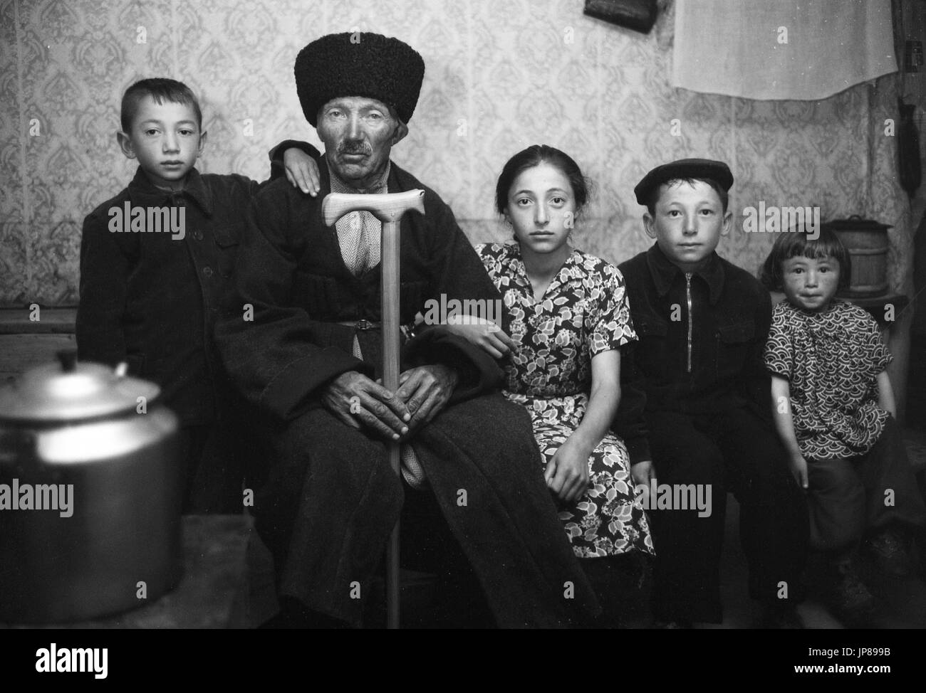 Elderly Cossack and his family in a remote village in the Caucasus Mountains, in Soviet Georgia near Tbilisi, 1956 Stock Photo
