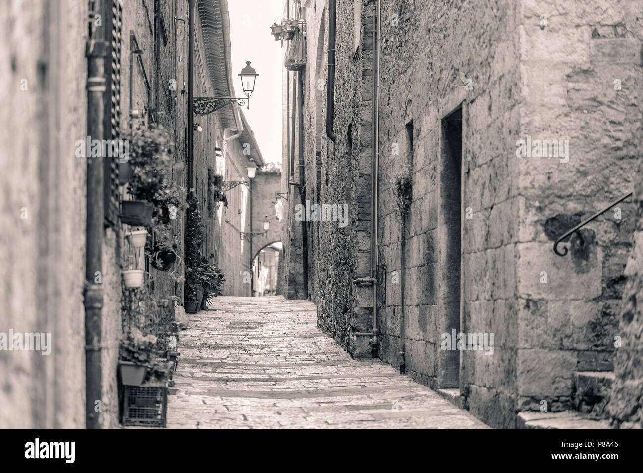 View of an alley in the historic district of Colle Val d'Elsa a small town near Siena in Tuscany Stock Photo