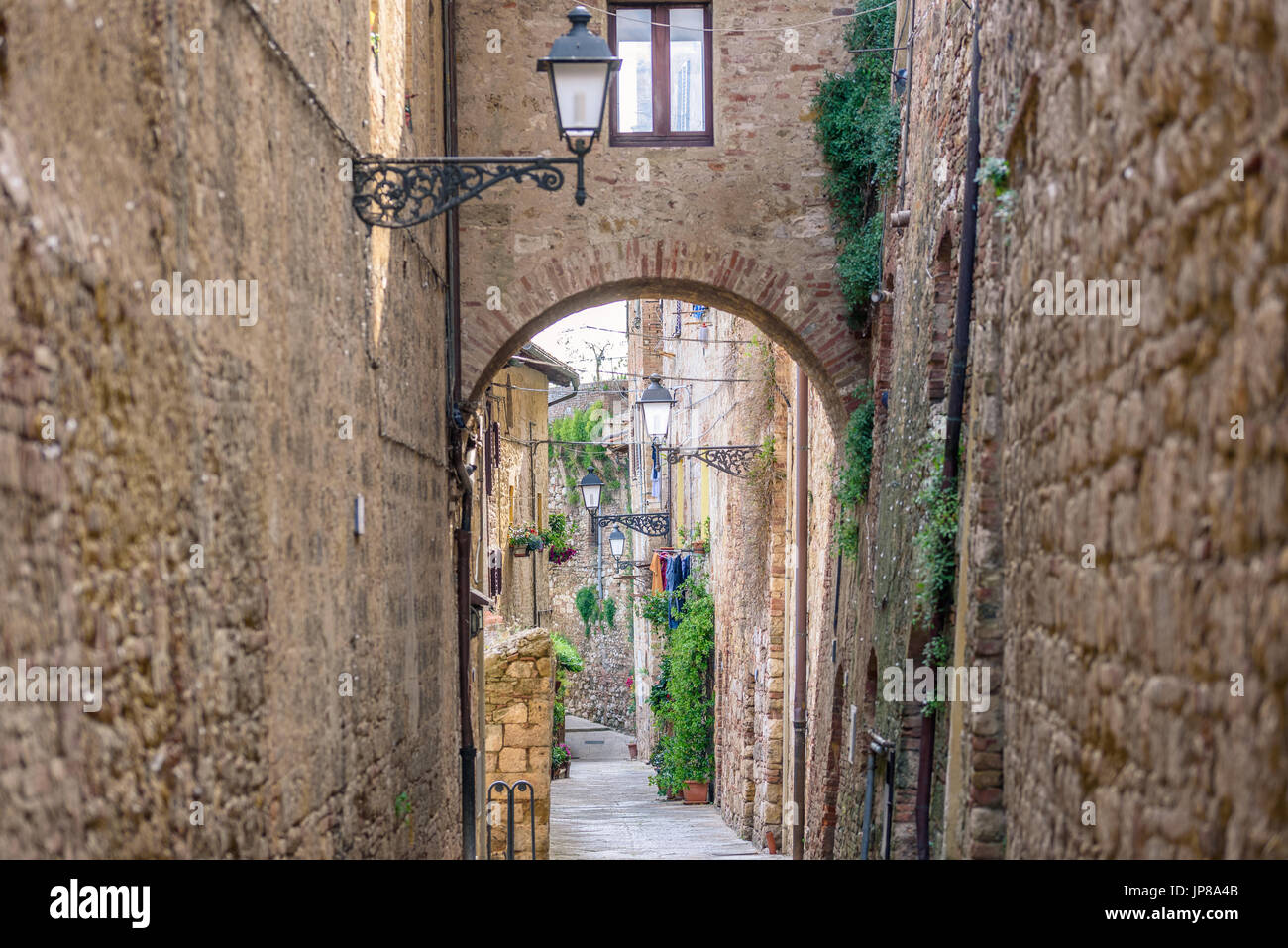 View of an alley in the historic district of Colle Val d'Elsa a small town near Siena in Tuscany Stock Photo