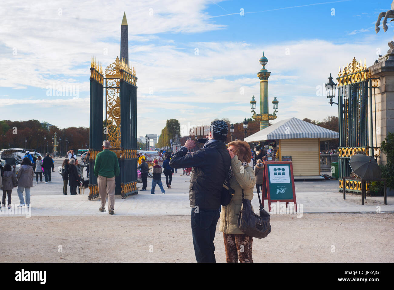 Paris, France - Tourists couple taking photo next to Jardin des Tuileries Stock Photo