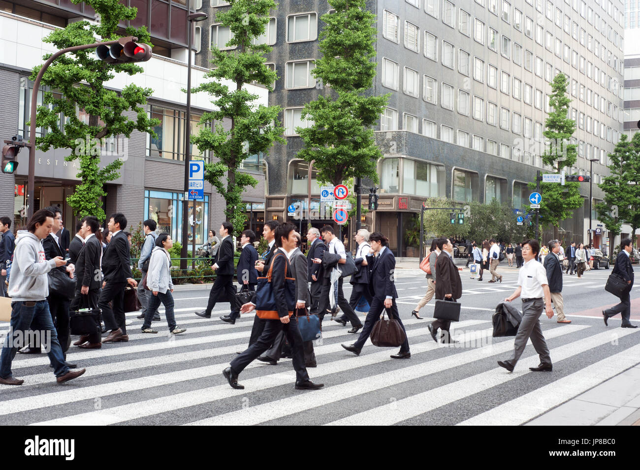 Tokyo, Japan - People crossing street in Ikebukuro Stock Photo