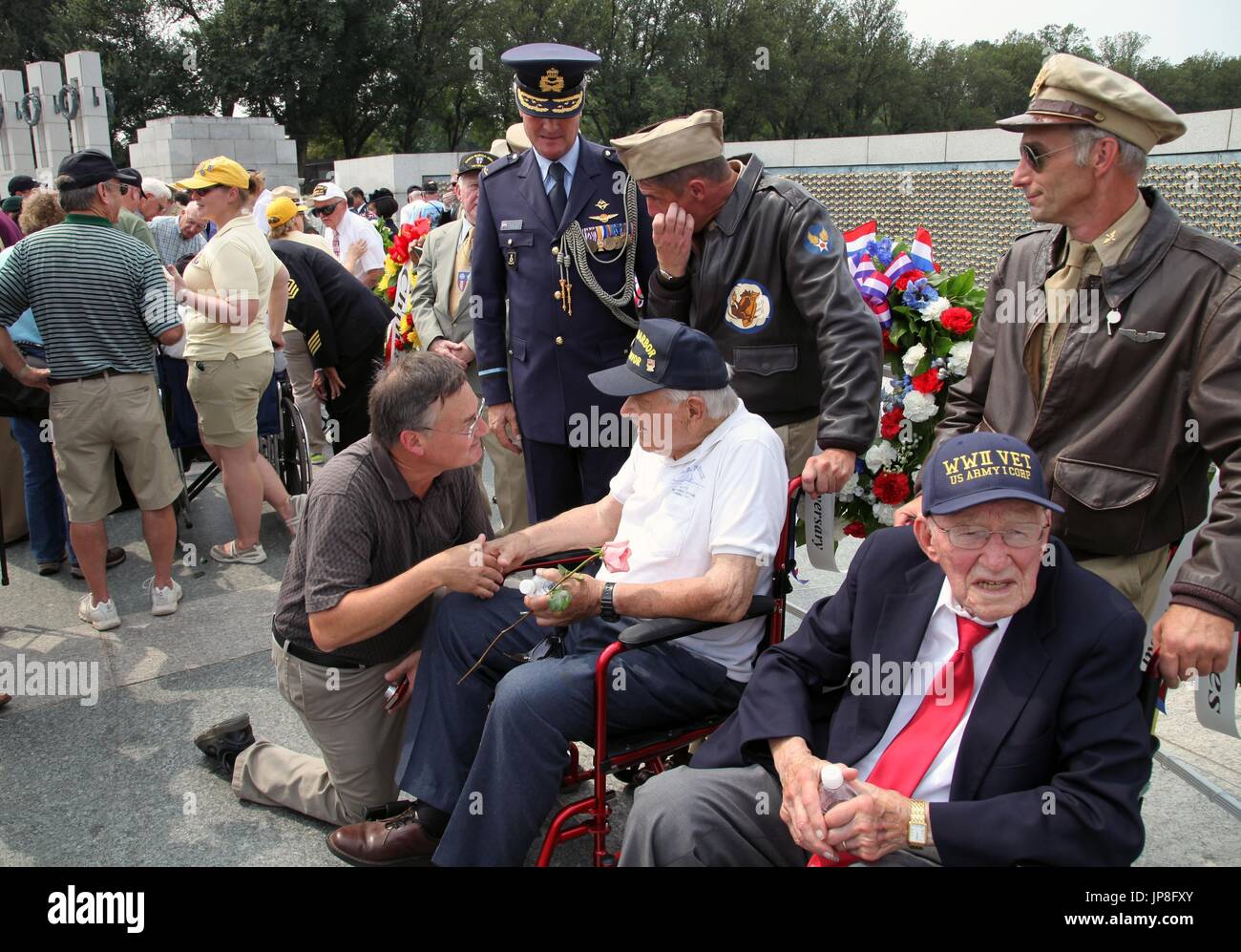 War veterans and others take part in a ceremony at the World War II ...