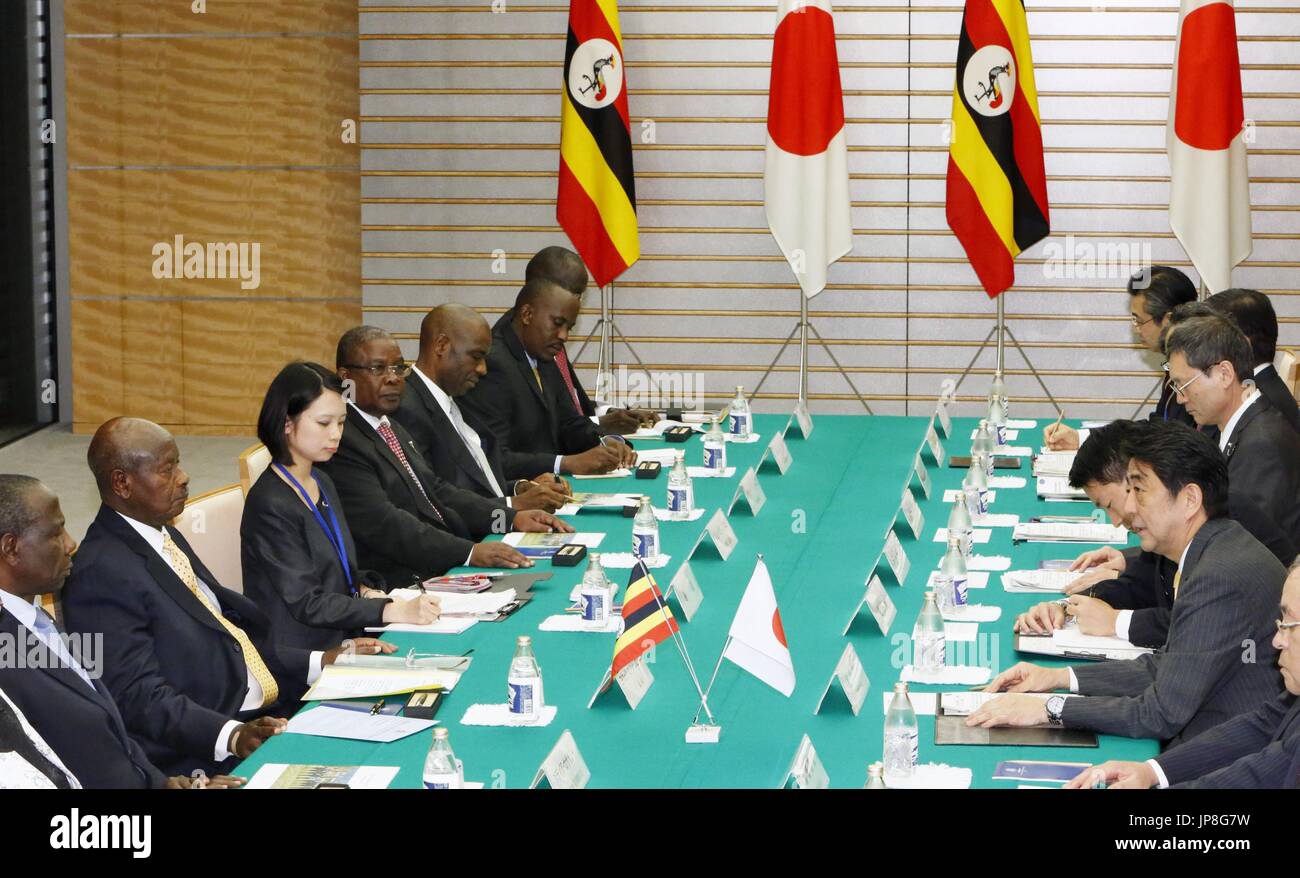 Uganda President Yoweri Kaguta Museveni 2nd From L And Japanese Prime Minister Shinzo Abe R