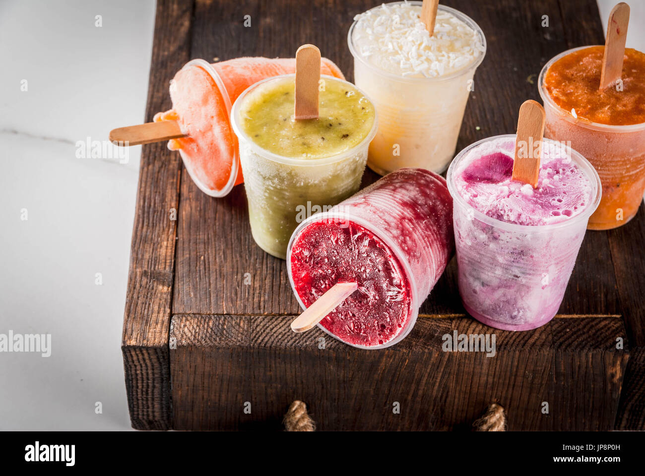 Healthy summer desserts. Ice cream popsicles. Frozen tropical juices