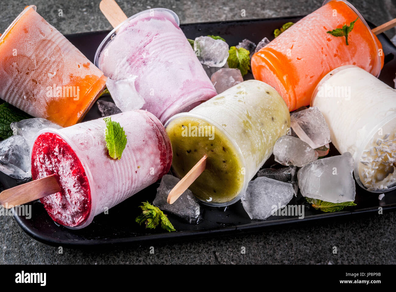 Healthy summer desserts. Ice cream popsicles. Frozen tropical juices