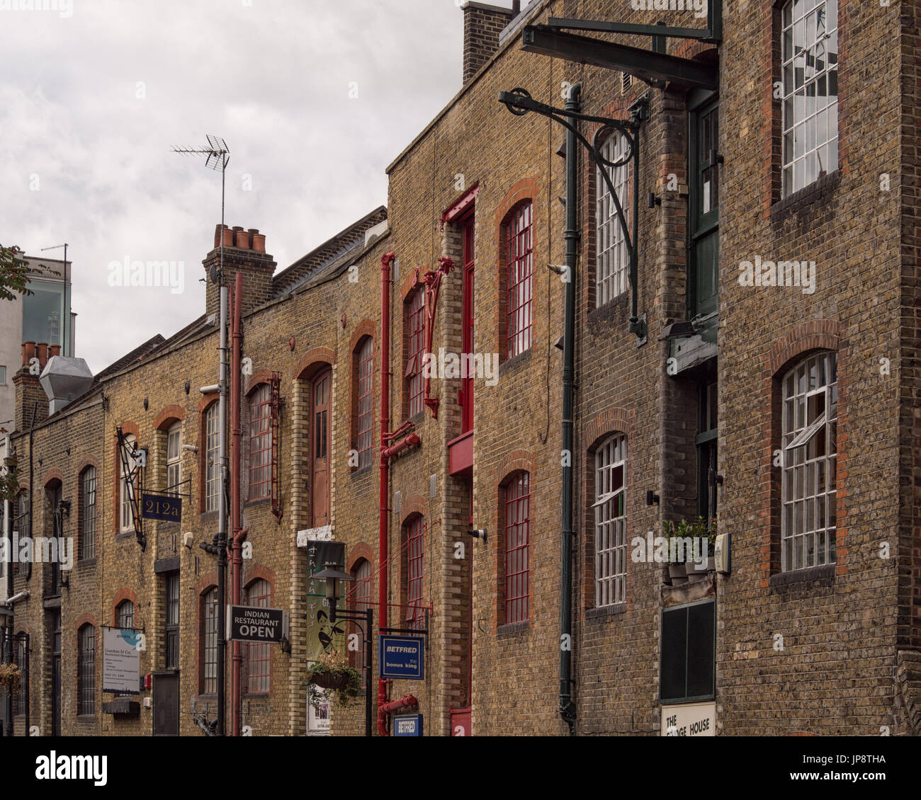 LONDON, UK - JULY 29, 2017:  View of old Warehouse Fixtures along Historic Street of Shad Thames in Bermondsey Stock Photo