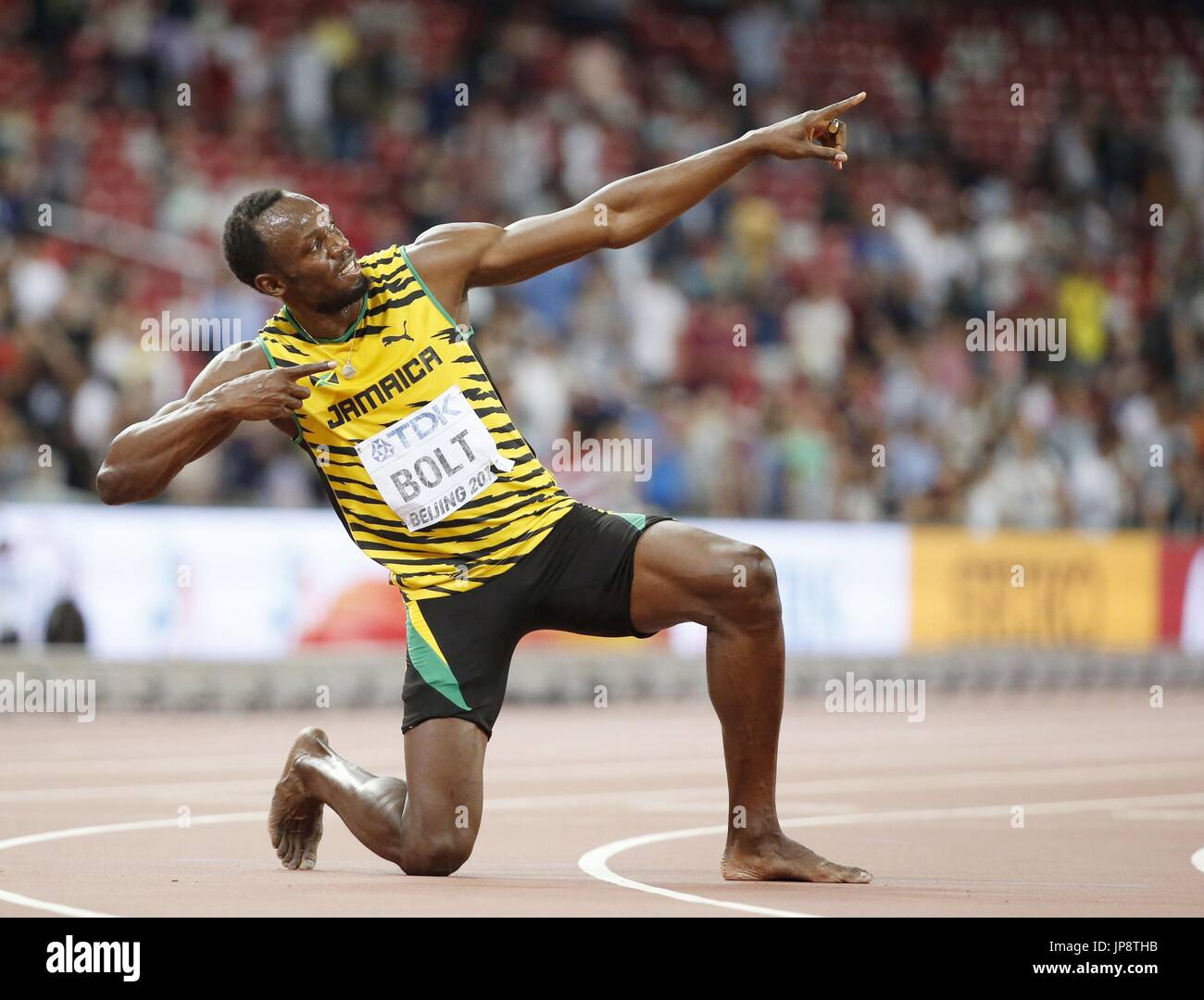 Jamaica's Usain Bolt strikes his signature lightning pose after winning