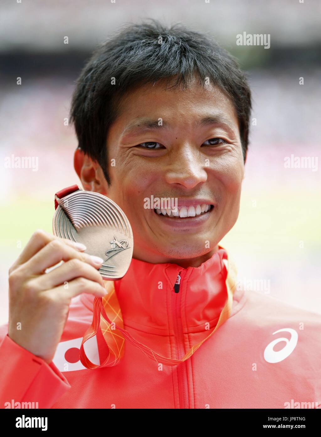 Japan's Takayuki Tanii poses for a photo with his bronze medal during