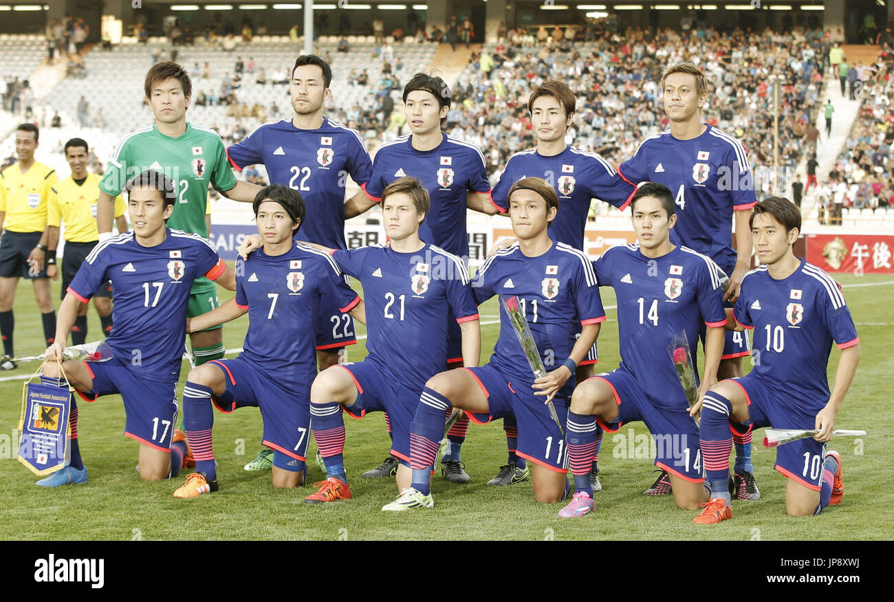 Members of Japan men's national soccer team pose for a photo ahead of a
