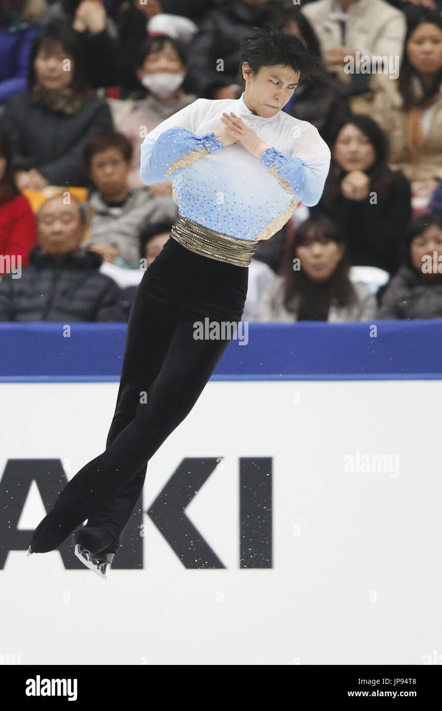 Japanese figure skater Yuzuru Hanyu performs a quadruple jump on his