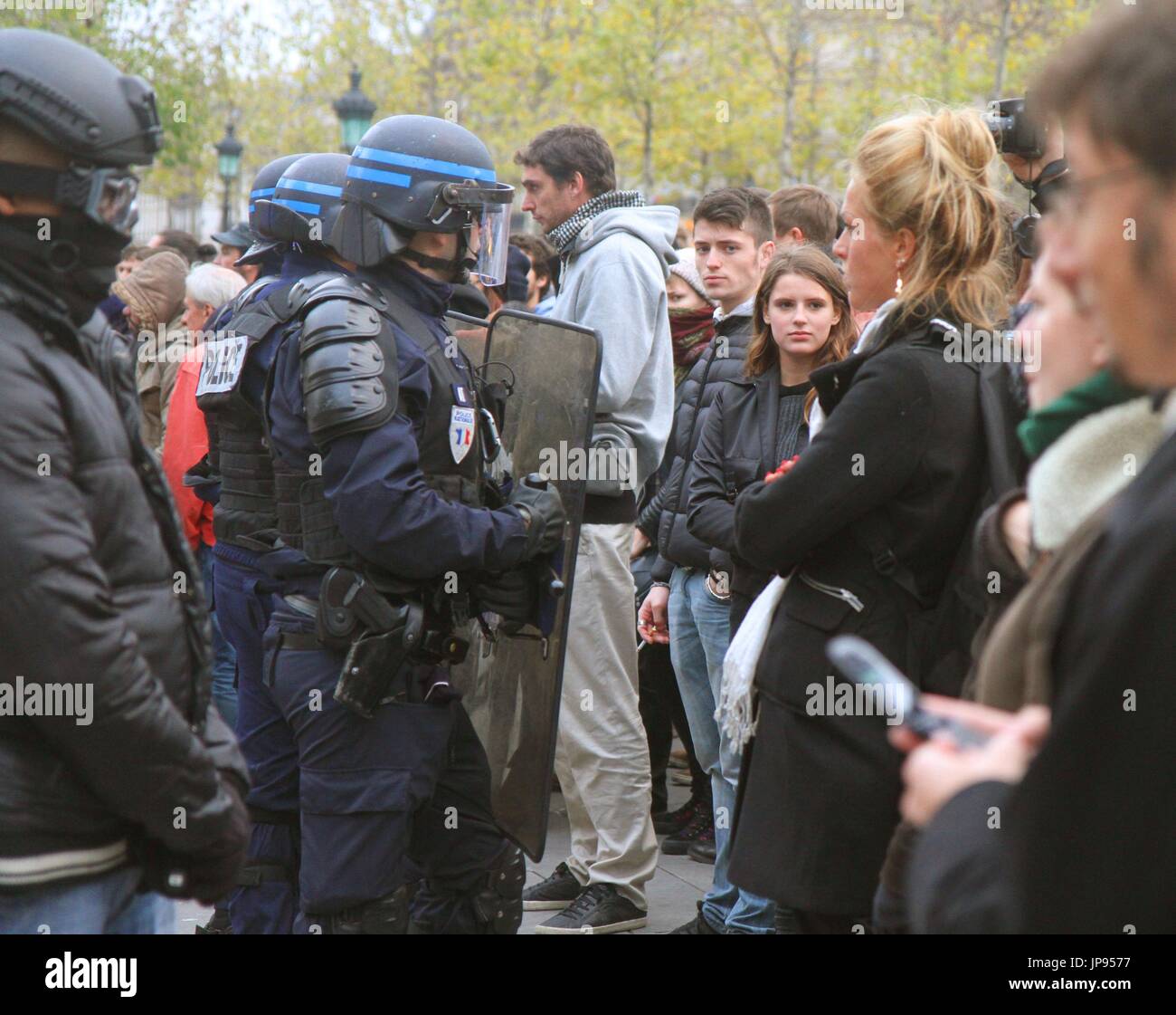 Riot police and citizens face each other at the Place de la Republique ...