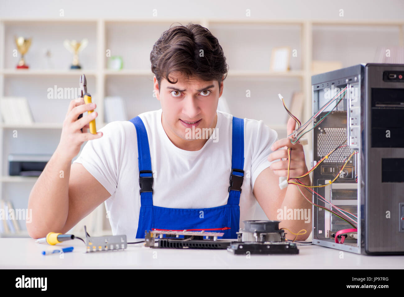 Computer repairman repairing desktop computer Stock Photo - Alamy