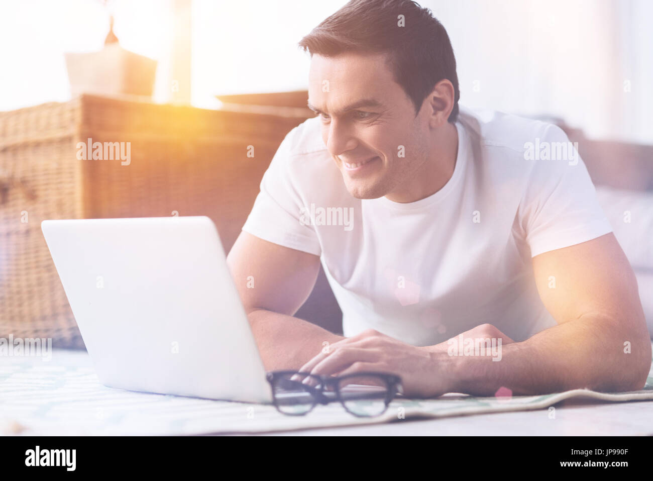 Happy man looking at screen of computer stock photo alamy