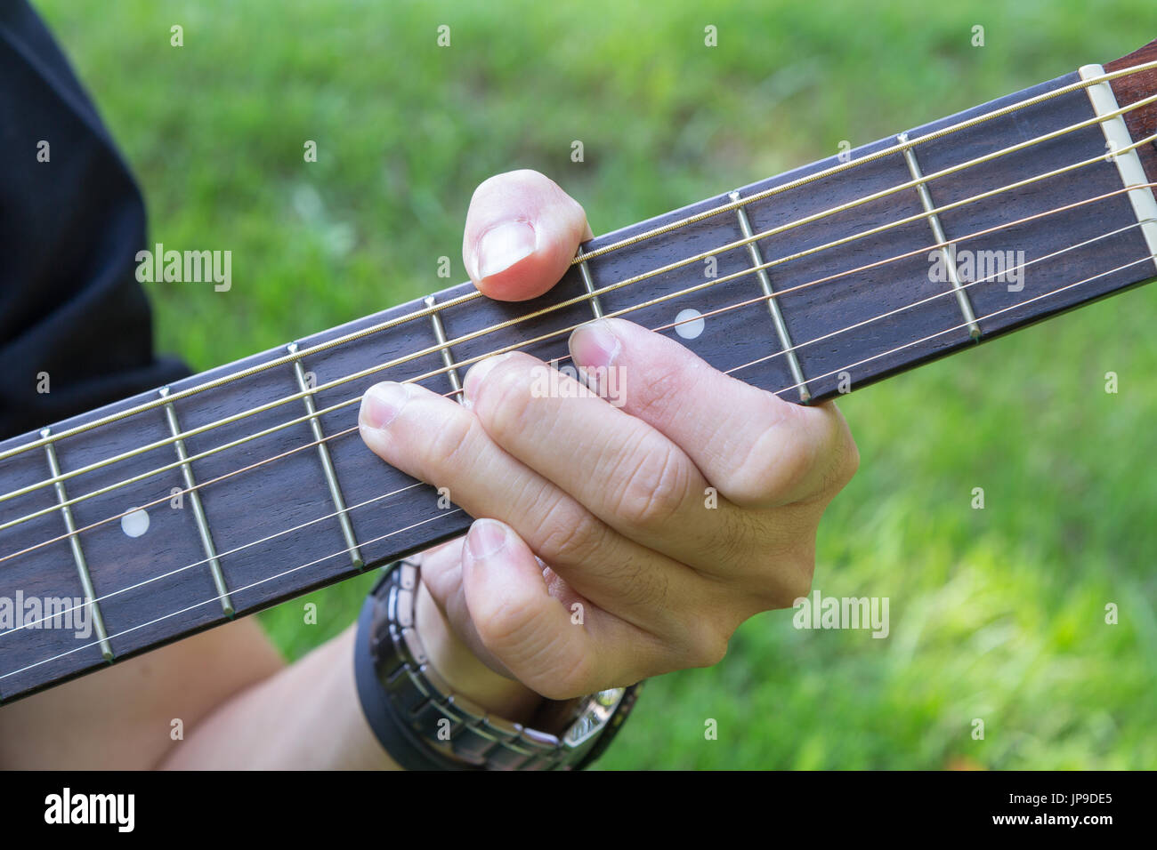 Bending the guitar string Stock Photo Alamy
