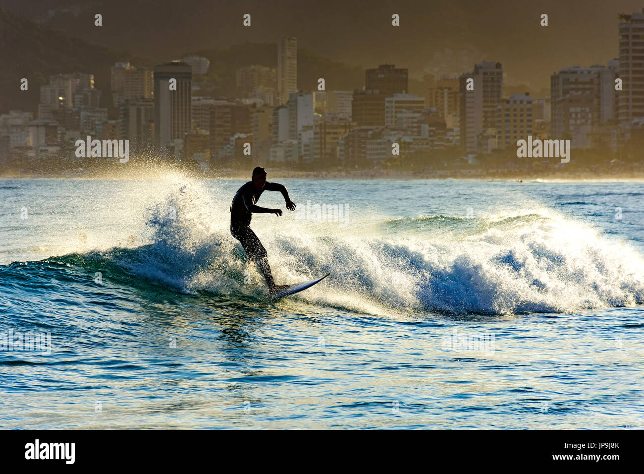 Surfing on Ipanema beach in Rio de Janeiro Stock Photo