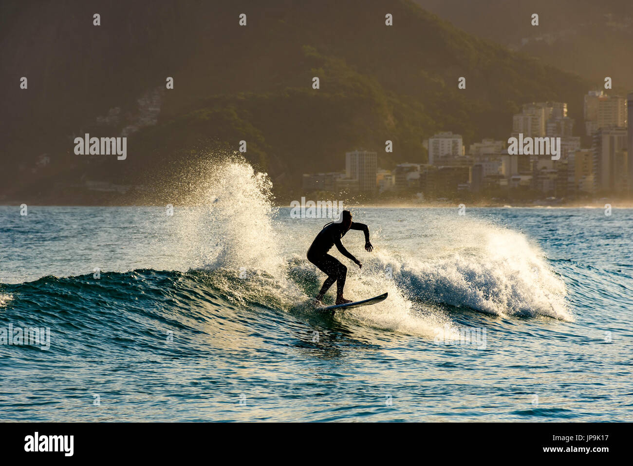 Surfing on Ipanema beach in Rio de Janeiro Stock Photo