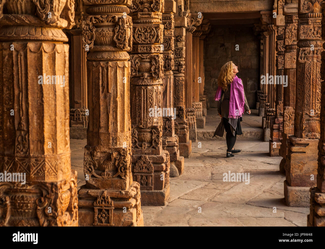 A line of ornate stone columns in the Qutb Complex, Delhi, India. Stock Photo