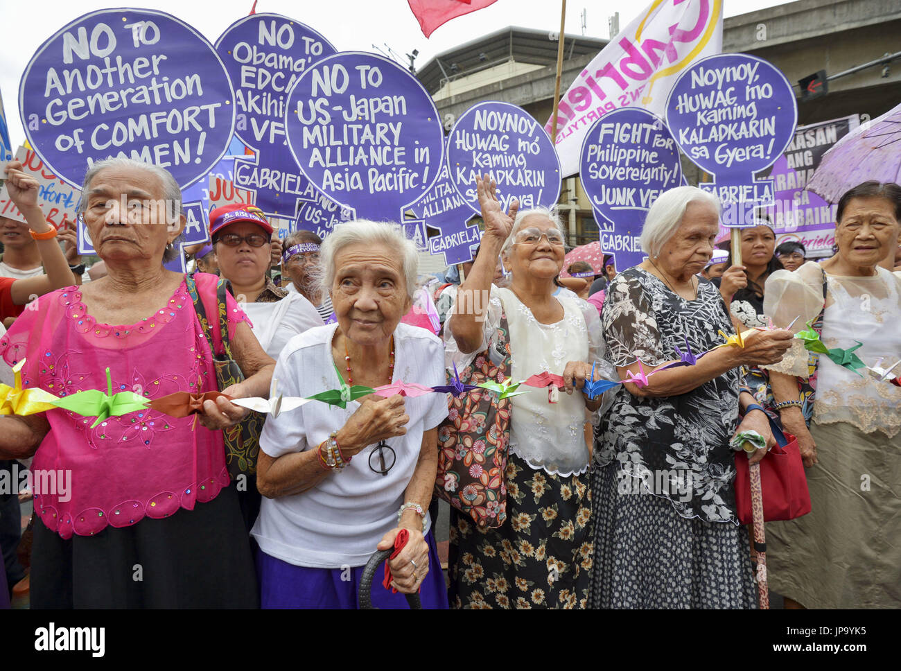 Filipino women forced to work in Japanese military brothels during World War II lead a protest near Malacanang Palace in Manila where Philippine President Benigno Aquino welcomed and met with visiting Japanese Emperor Akihito and Empress Michiko on Jan. 27, 2016. The former so-called "comfort women," who are now mainly in their 80s, said they were availing themselves of the opportunity presented by the emperor's visit to demand justice from the Japanese government for their sufferings during the 1942-1945 Japanese occupation. (Kyodo) ==Kyodo Stock Photo