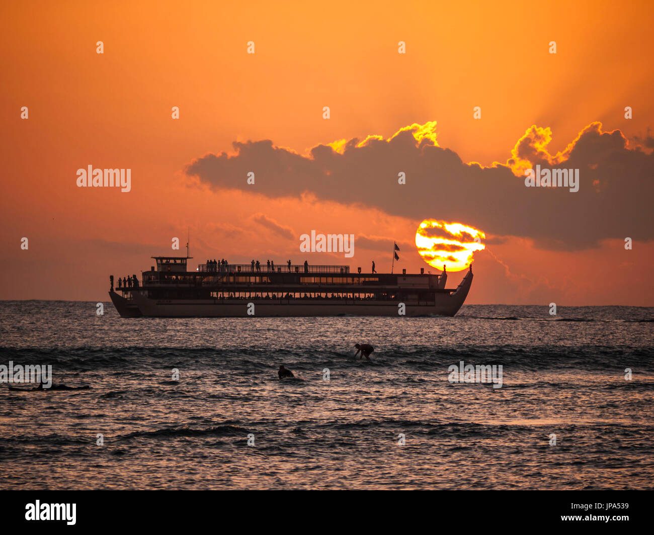 Tourist Ship at Sunset, Waikiki, Oahu, Hawaii, Stock Photo