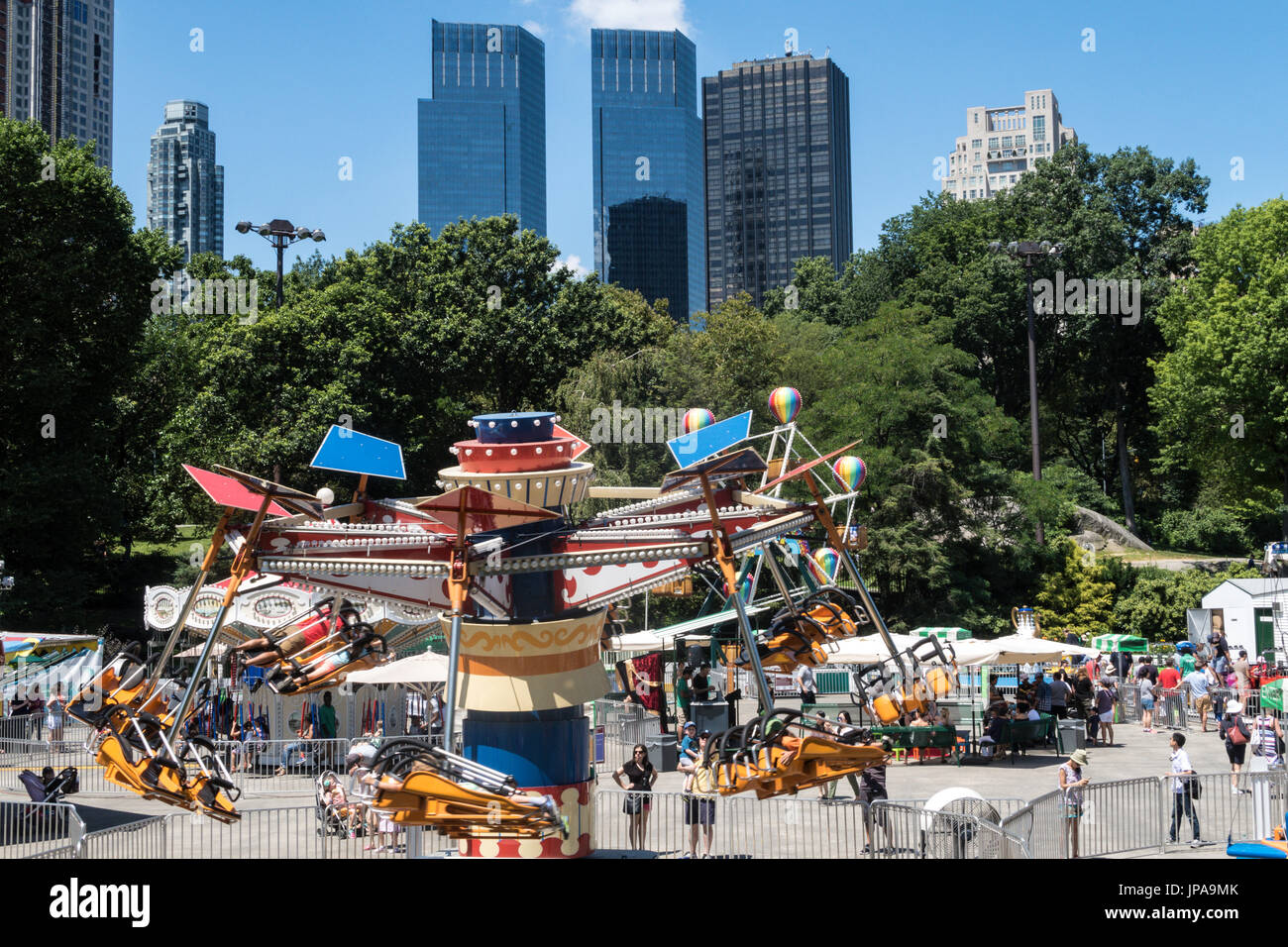Victorian Gardens Carnival Rides In Central Park With Skyline In