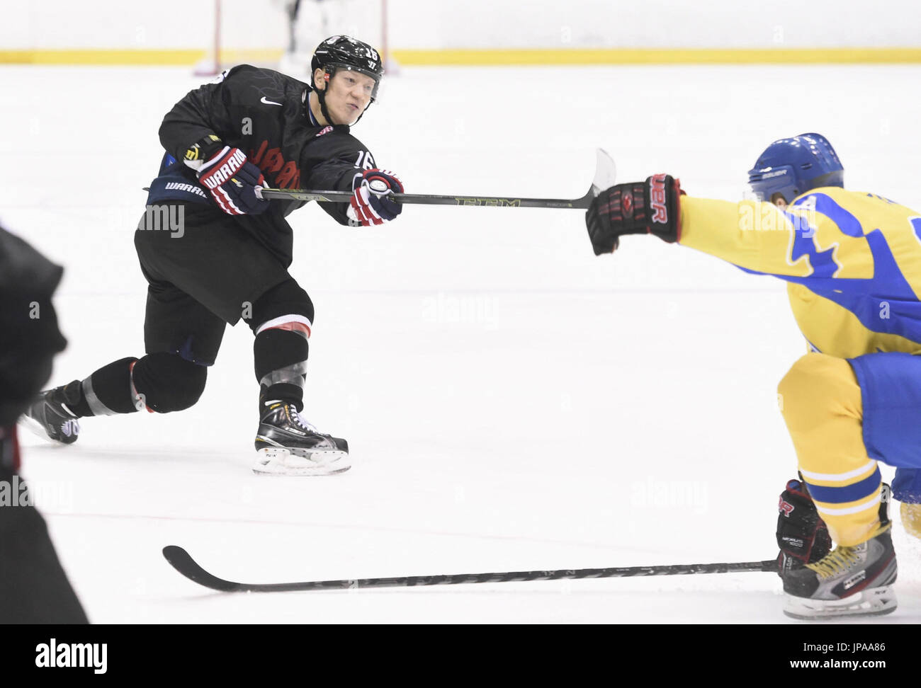 Daisuke Obara of Japan (L) scores his side's second goal during the