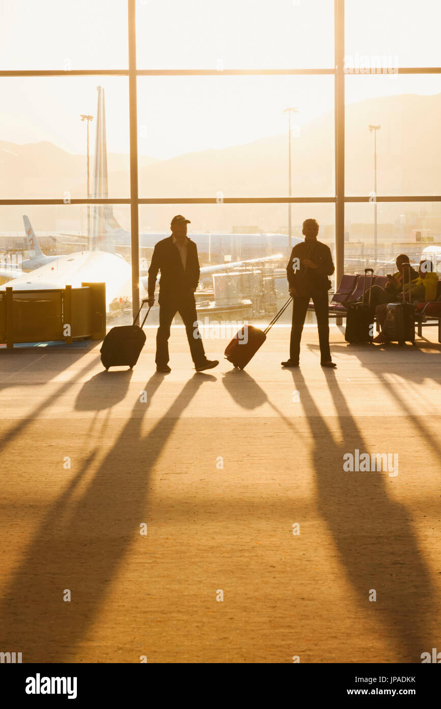 China, Hong Kong, Hong Kong International Airport, Passengers in Departure Lounge Stock Photo