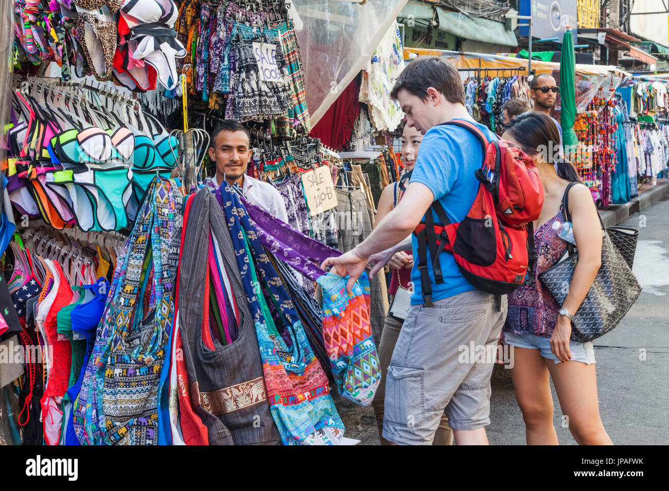 Thailand, Bangkok, Khaosan Road, Tourists Buying Clothing Stock Photo