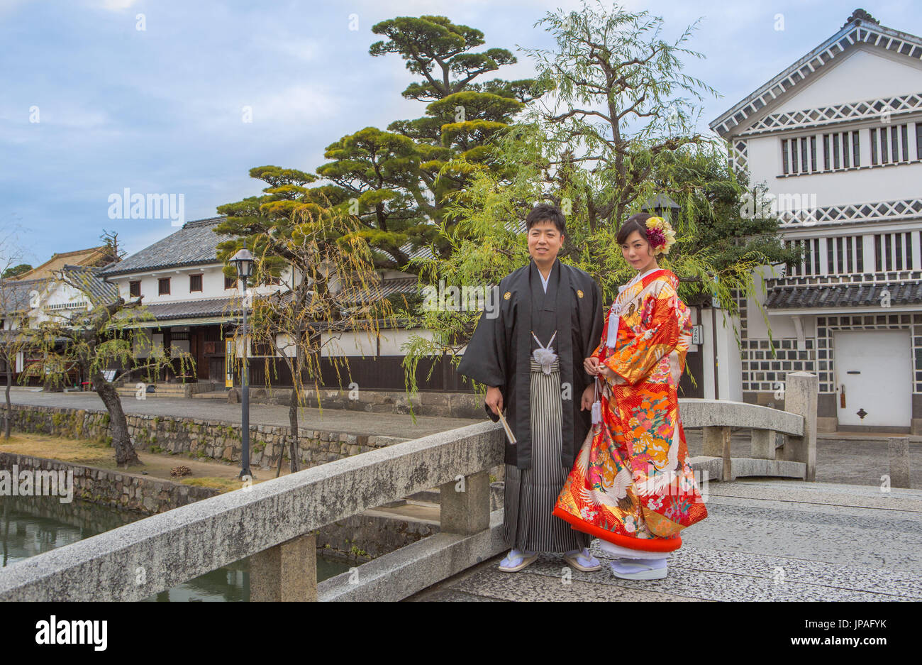 Japan, Okayama, Kurashiki City, Couple in traditional costume Stock Photo