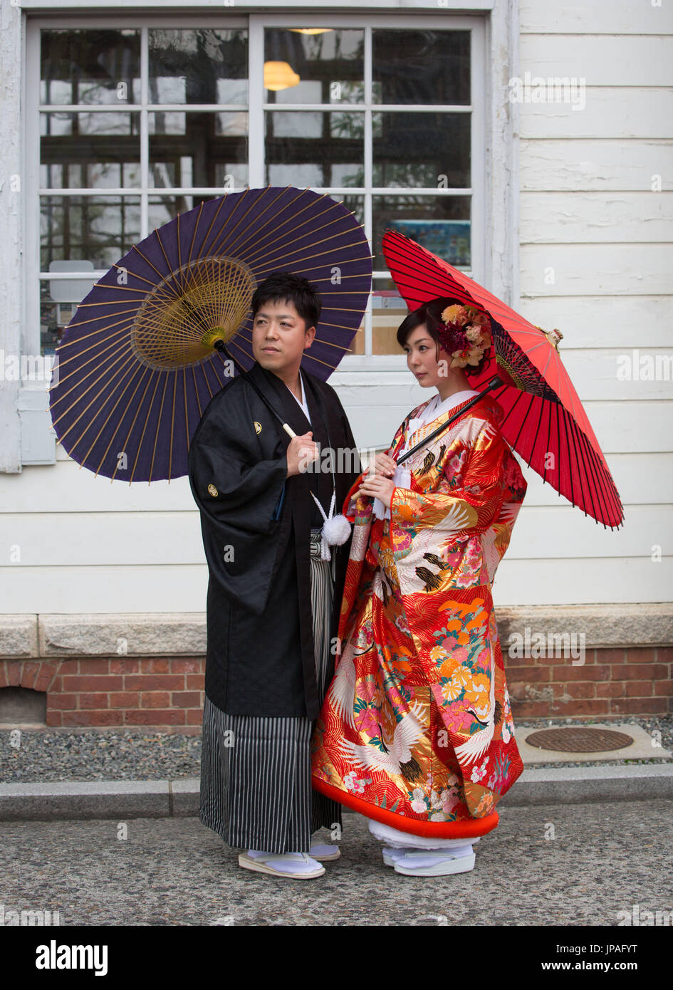 Japan, Okayama, Kurashiki City, Couple in traditional costume Stock Photo