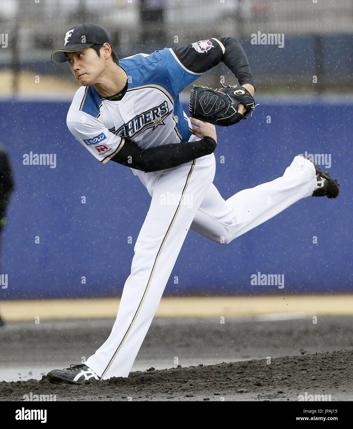 Nippon Ham Fighters ace Shohei Otani pitches against the DeNA BayStars in a  preseason game called in the third inning due to rain in Kamagaya, Chiba  Prefecture on March 9, 2016. The