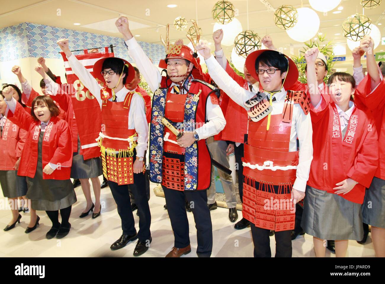 Staff at a Kintetsu department store in Osaka raise their voices on May