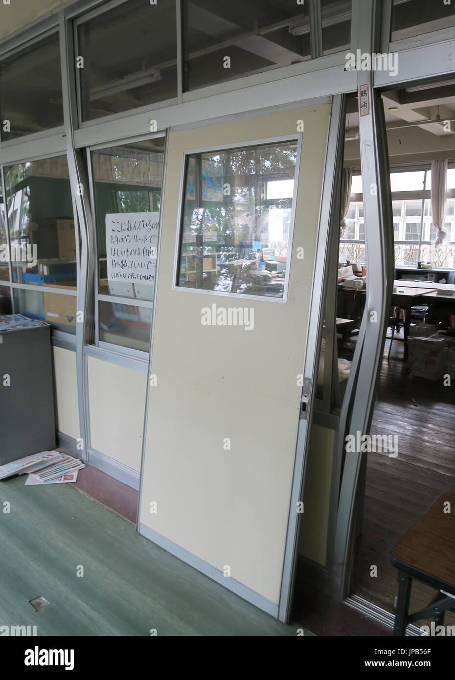 Frames of a classroom door and windows are seen bent April 24, 2016, at