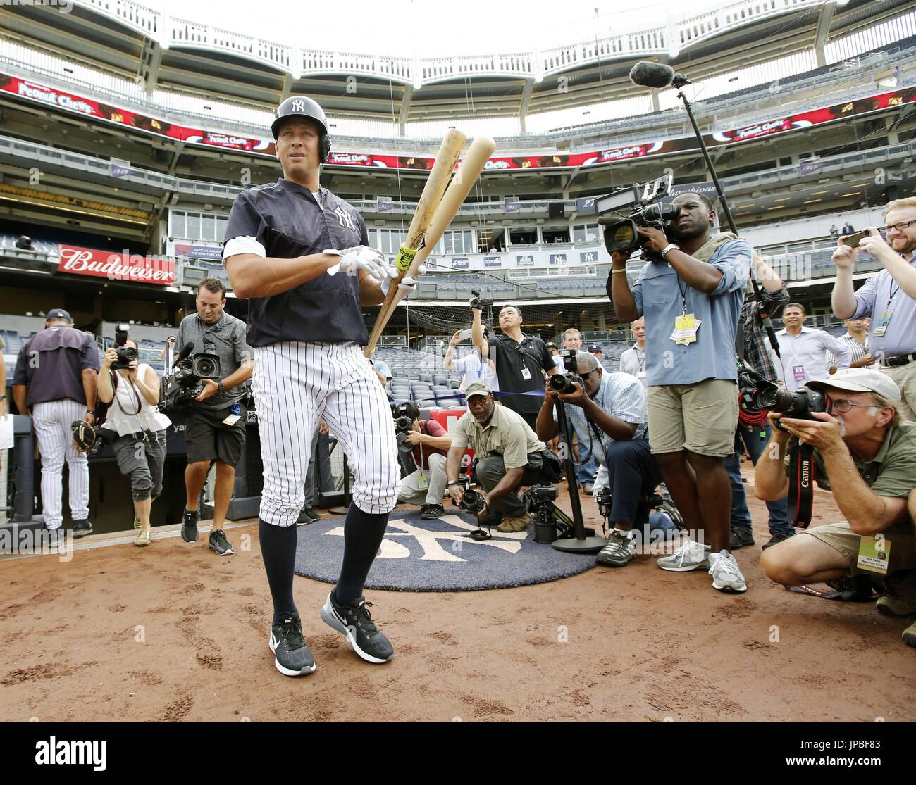 Alex Rodriguez of the New York Yankees is surrounded by photographers during pregame batting