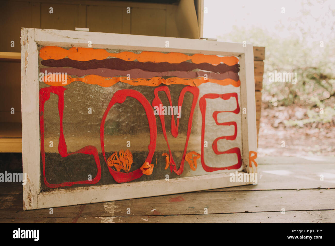 garden shed, sign / old window with the inscription 'Love' Stock Photo