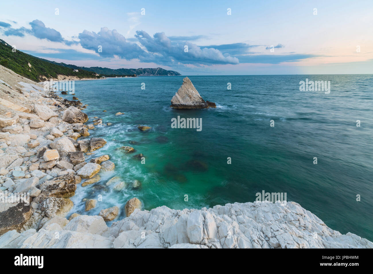 White cliffs frame the turquoise sea at sunrise La Vela Beach Portonovo province of Ancona Conero Riviera Marche Italy Europe Stock Photo